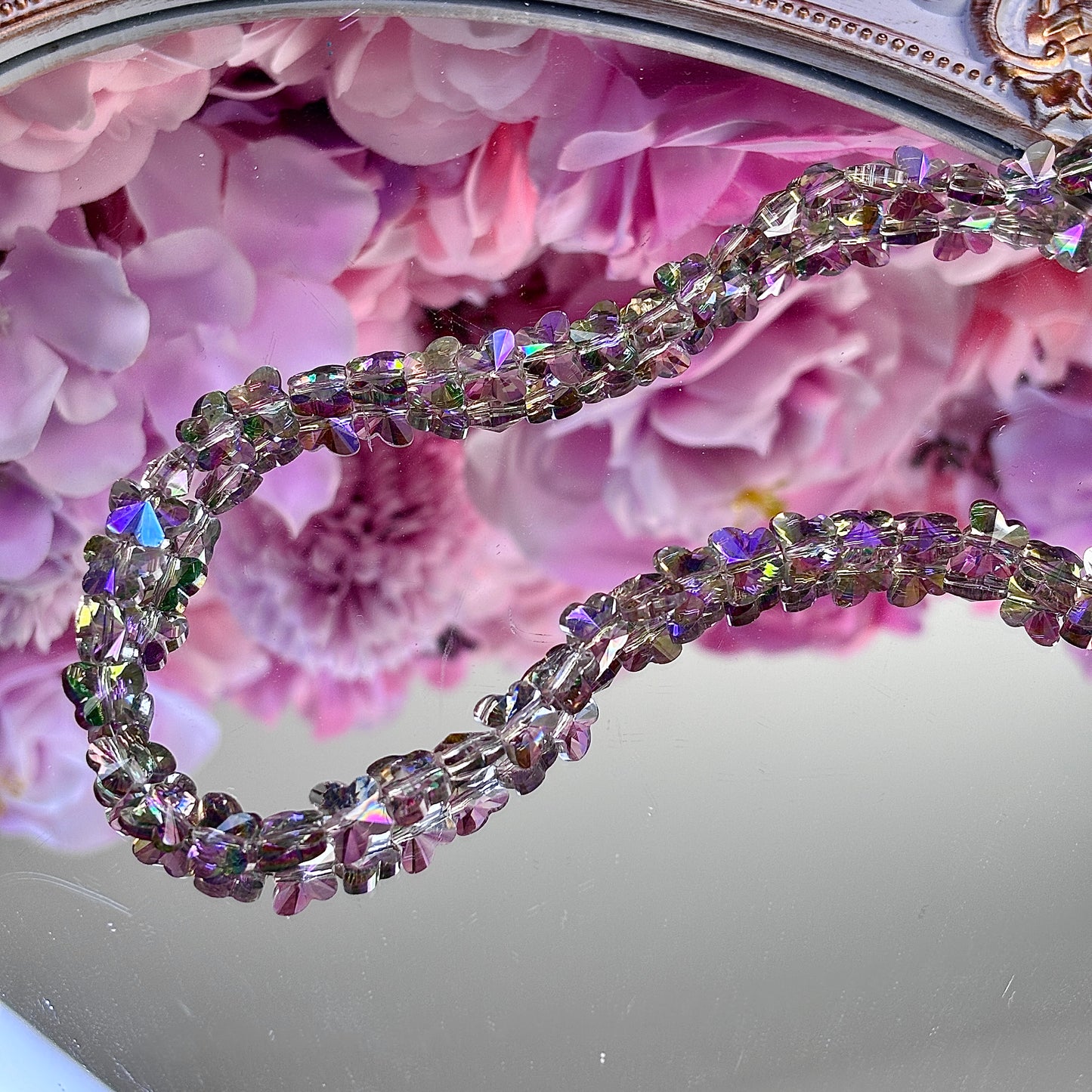 Butterfly-shaped, glittering brightly
