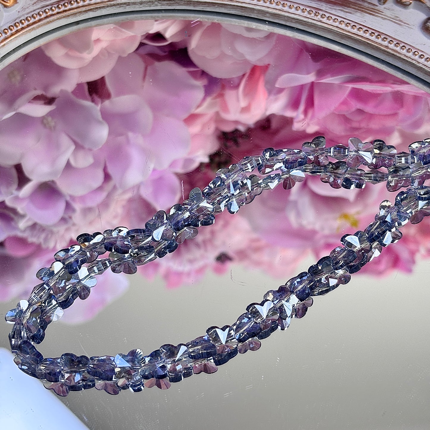 Butterfly-shaped, glittering brightly
