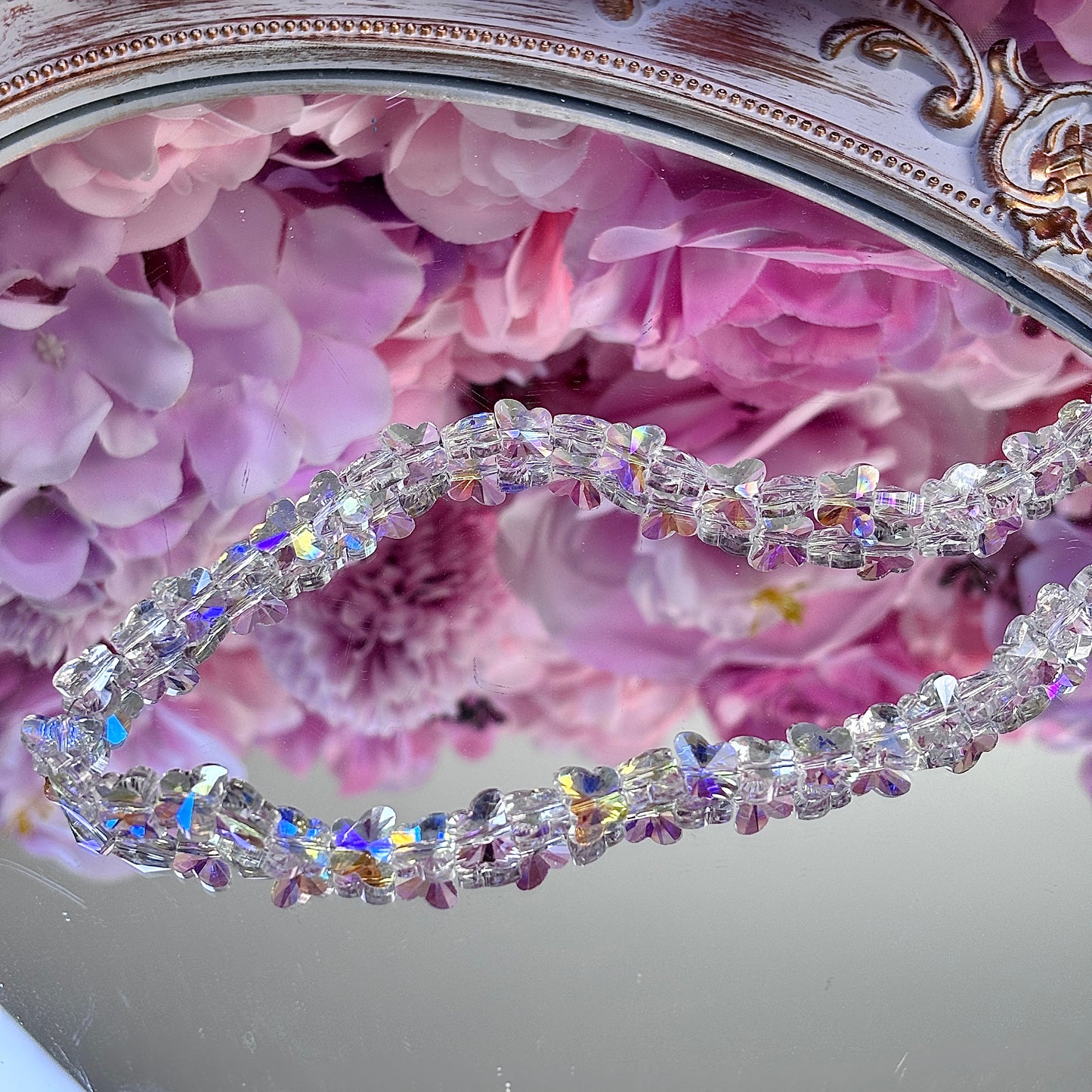 Butterfly-shaped, glittering brightly