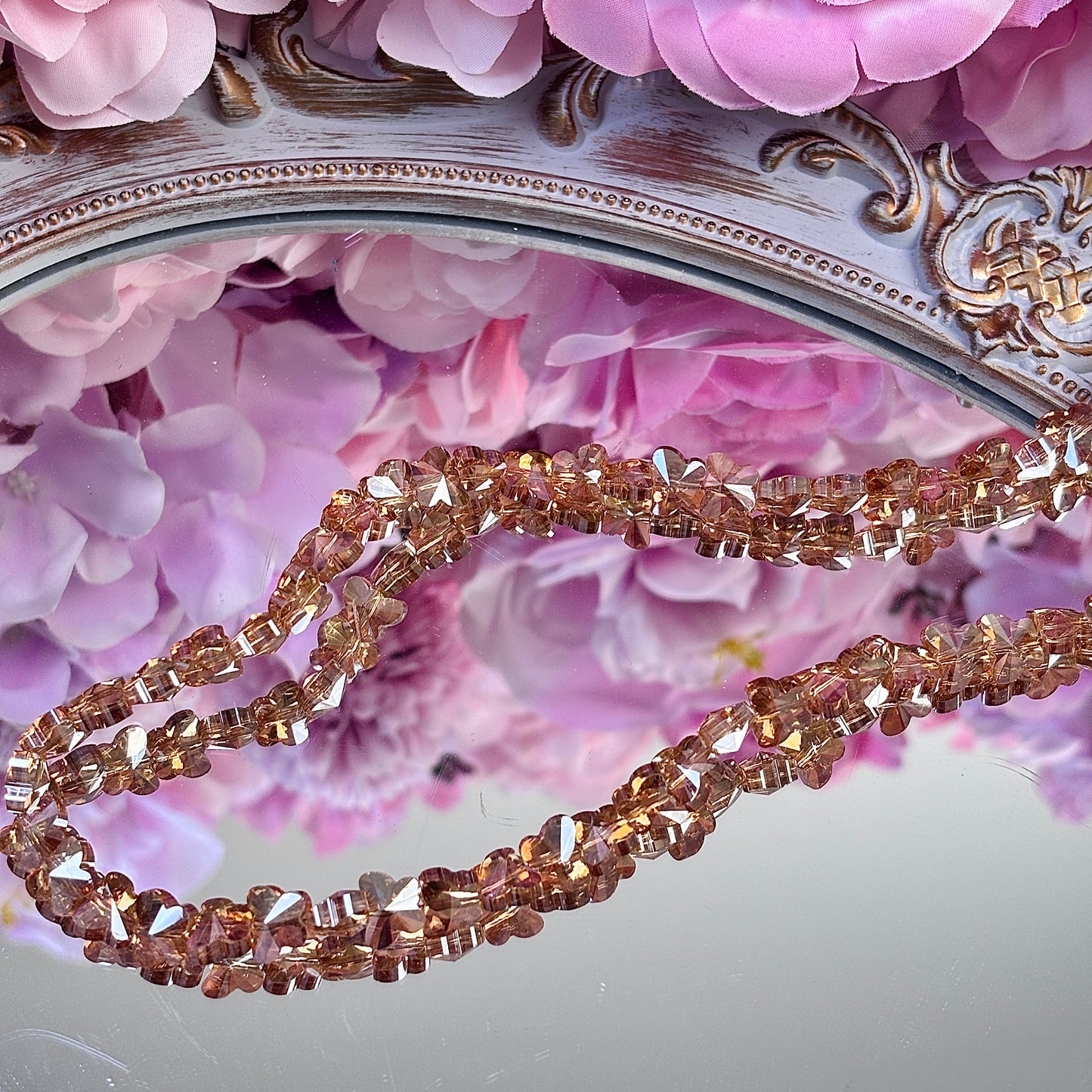 Butterfly-shaped, glittering brightly