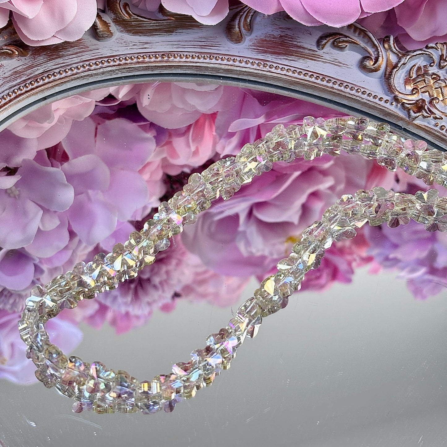 Butterfly-shaped, glittering brightly